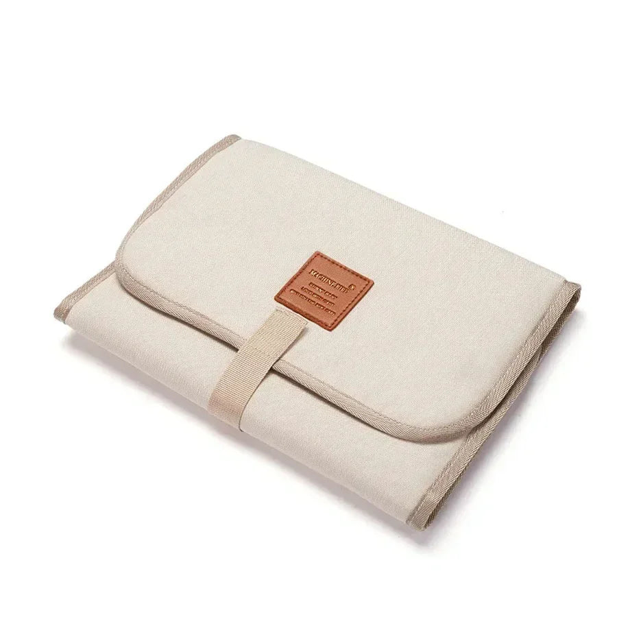 Travel-friendly baby changing pad, waterproof exterior, soft interior, essential for baby hygiene
