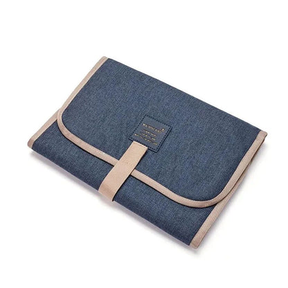 Portable baby changing clutch, waterproof material, fits in diaper bag, unisex design