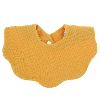 Close-up of a premium soft cotton baby bib, unisex design, showing texture and embroidery detail
