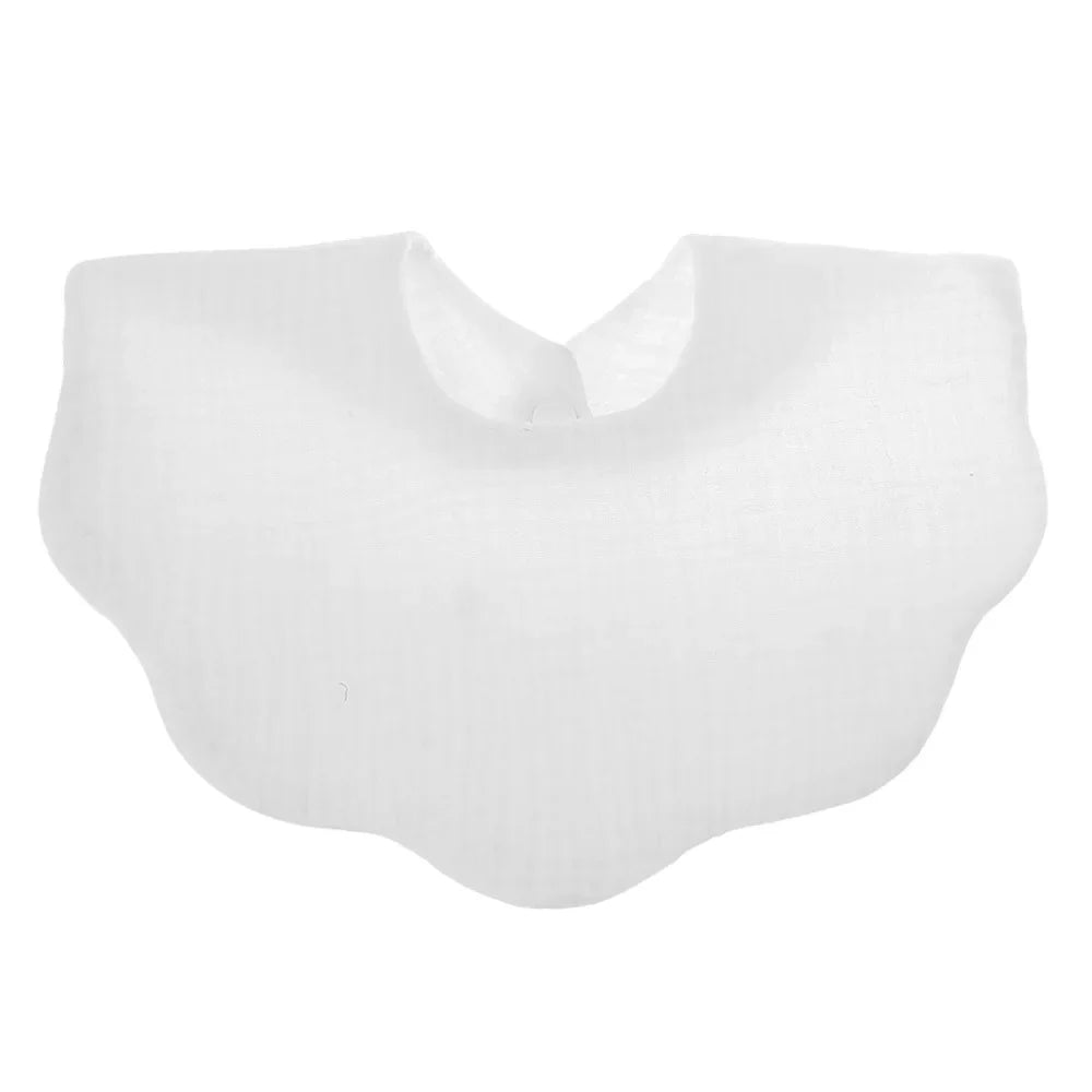 Infant happily eating while wearing a soft cotton feeding bib, unisex design, keeping clothes clean