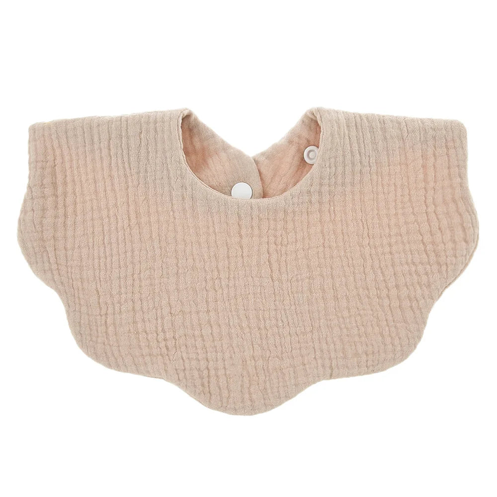 Premium soft cotton baby bib in a neutral cream color, unisex, essential for everyday infant use