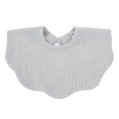 Close-up of the ultra-soft fabric of a unisex cotton baby bib, highlighting comfort for newborn skin