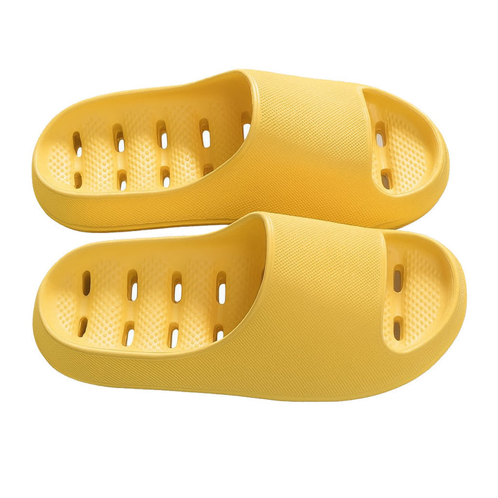 Lightweight unisex shower slippers featuring anti-slip sole, quick-dry design, and efficient drainage holes.