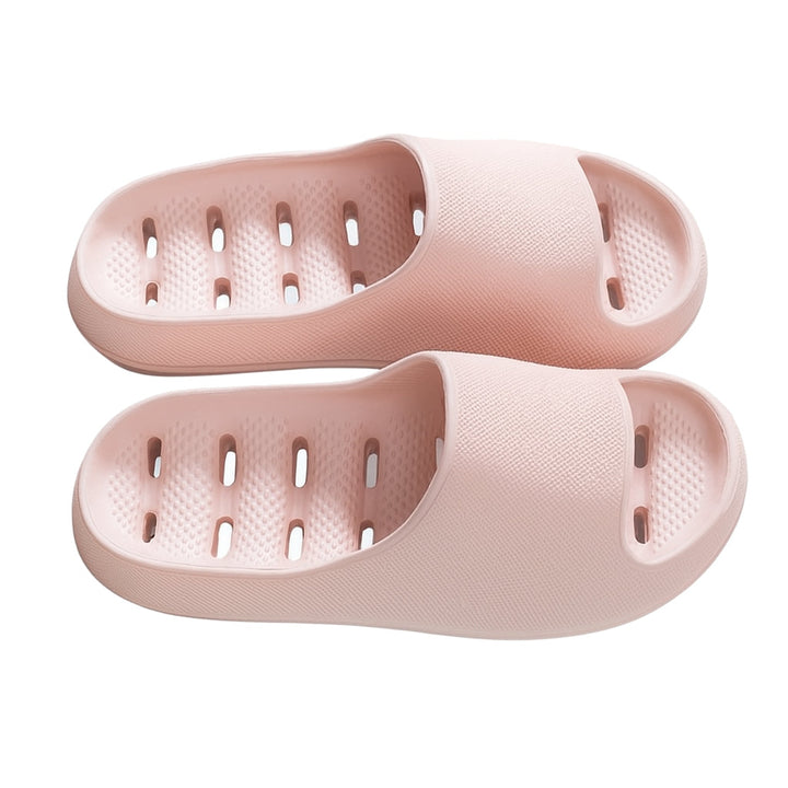 Waterproof quick-dry shower slippers with ergonomic design and drainage, anti-slip for safety in bathrooms.