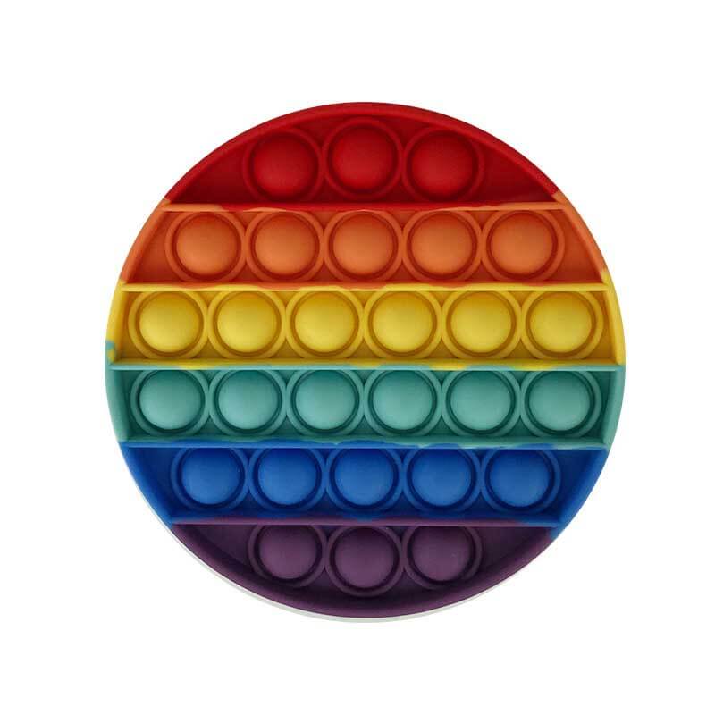 Assortment of silicone push pop fidget toys on a light background, highlighting vibrant colors