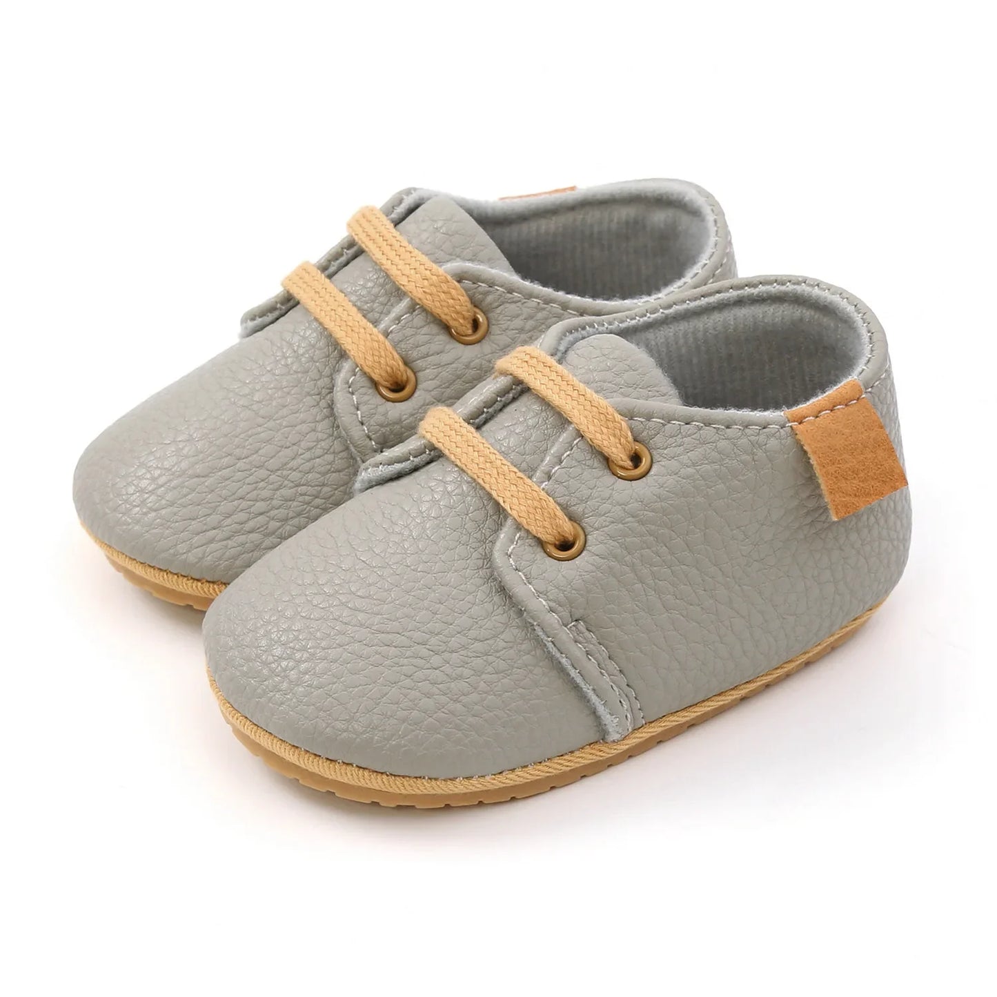 Close-up of navy blue leather infant moccasins, lightweight and breathable