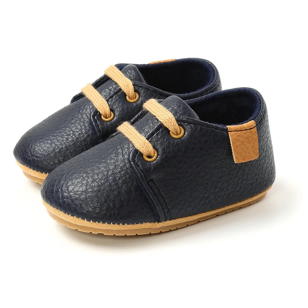 Side profile of lace-up retro pink baby shoes, perfect first walking footwear