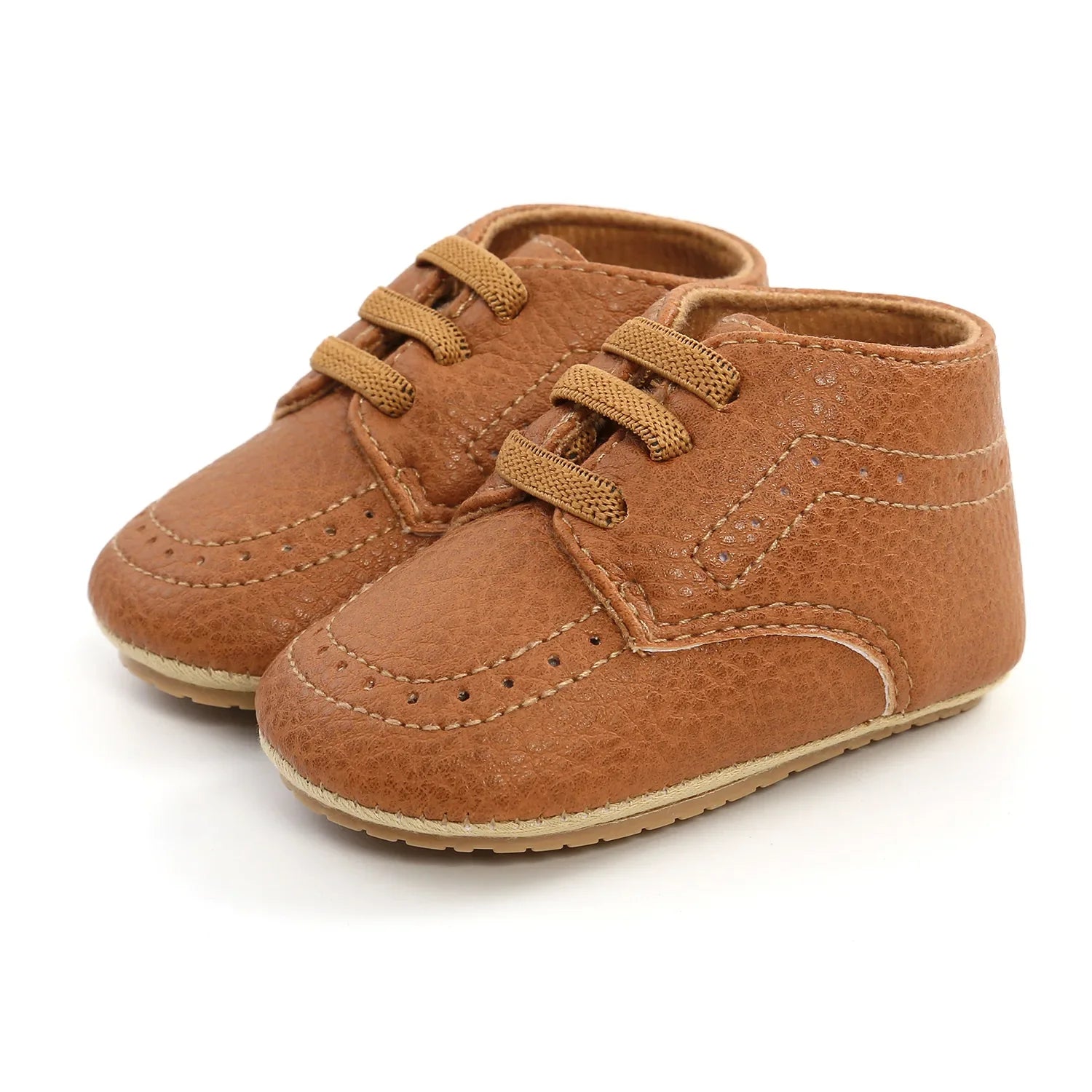 Infant feet in retro brown leather moccasins, showing comfortable fit and design