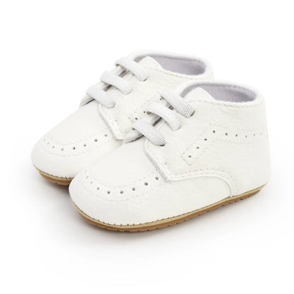 Baby standing in retro leather moccasins, highlighting anti-slip soft sole