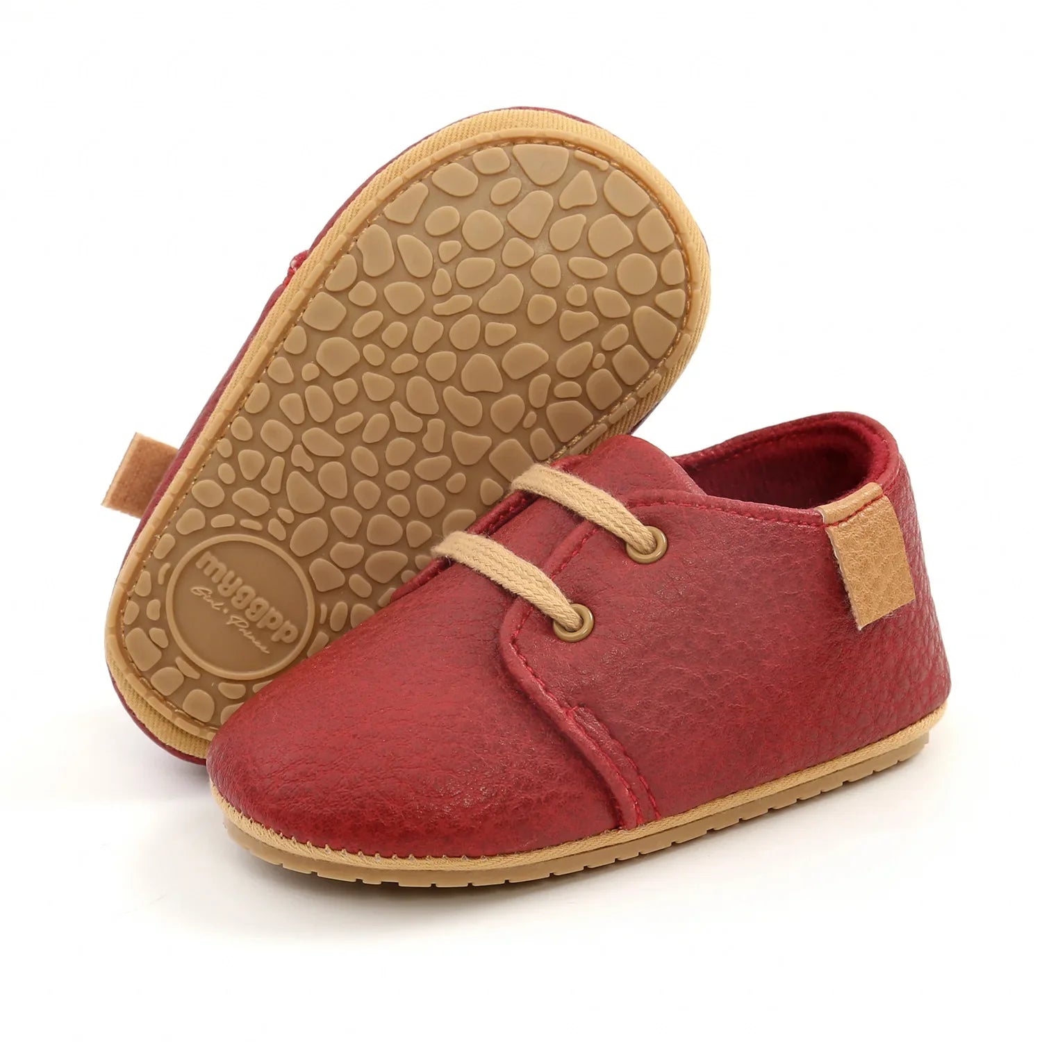 Pair of unisex toddler moccasins in black, breathable and lightweight for infant