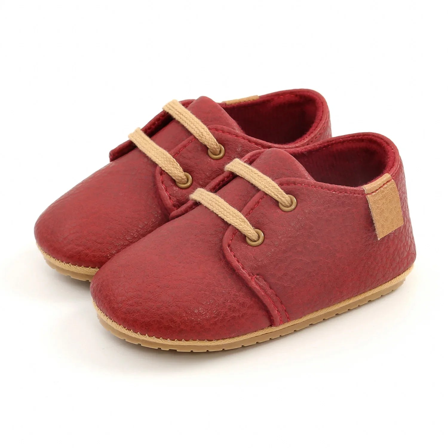 Retro leather baby shoes, multiple colors displayed side-by-side on a shelf