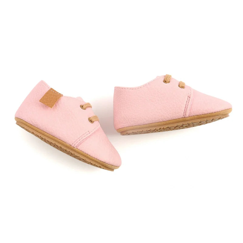 Pair of unisex toddler moccasins, breathable and lightweight for infant development
