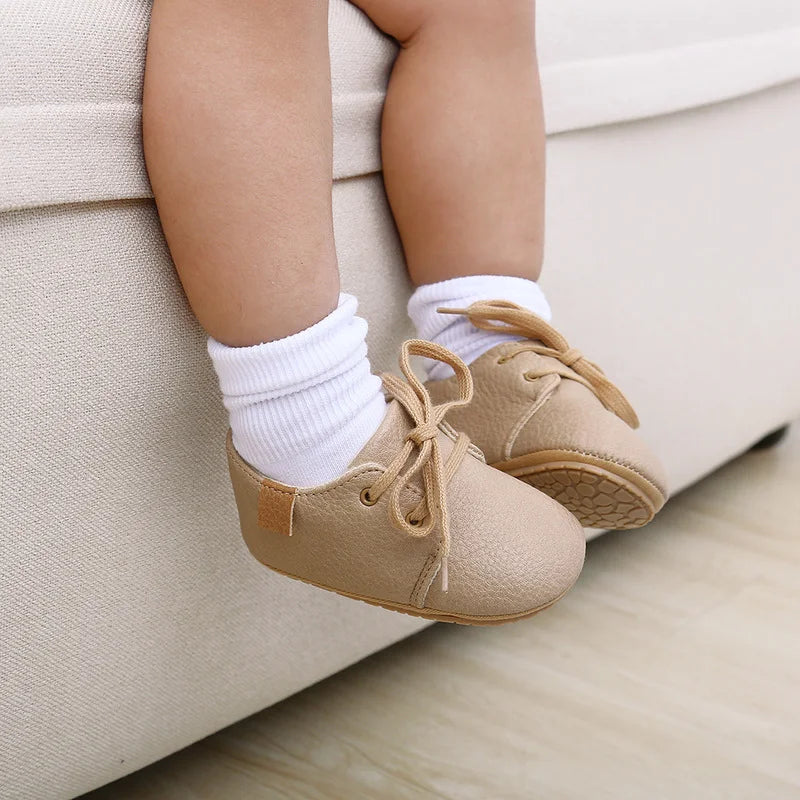 Top-down view of anti-slip retro baby shoes, perfect for new walkers