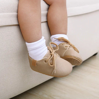 Top-down view of anti-slip retro baby shoes, perfect for new walkers