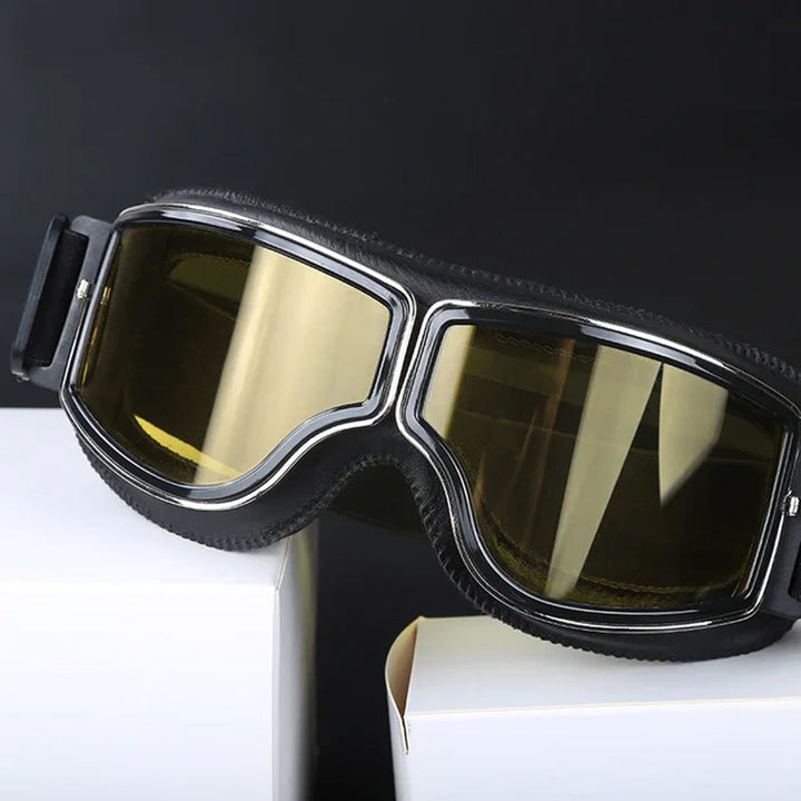 Retro motorcycle eyewear, dark tinted lenses for strong UV protection during outdoor rides.