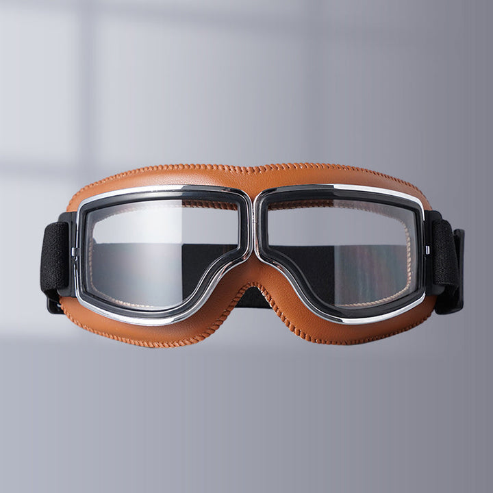 Unisex vintage motorcycle goggles, black leather padding & anti-fog lenses for comfort.