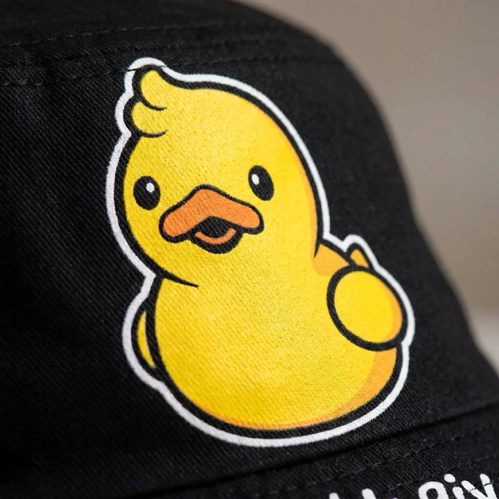 Reversible unisex bucket hat with fun cartoon bird pattern. Casual summer fashion accessory, great for travel.