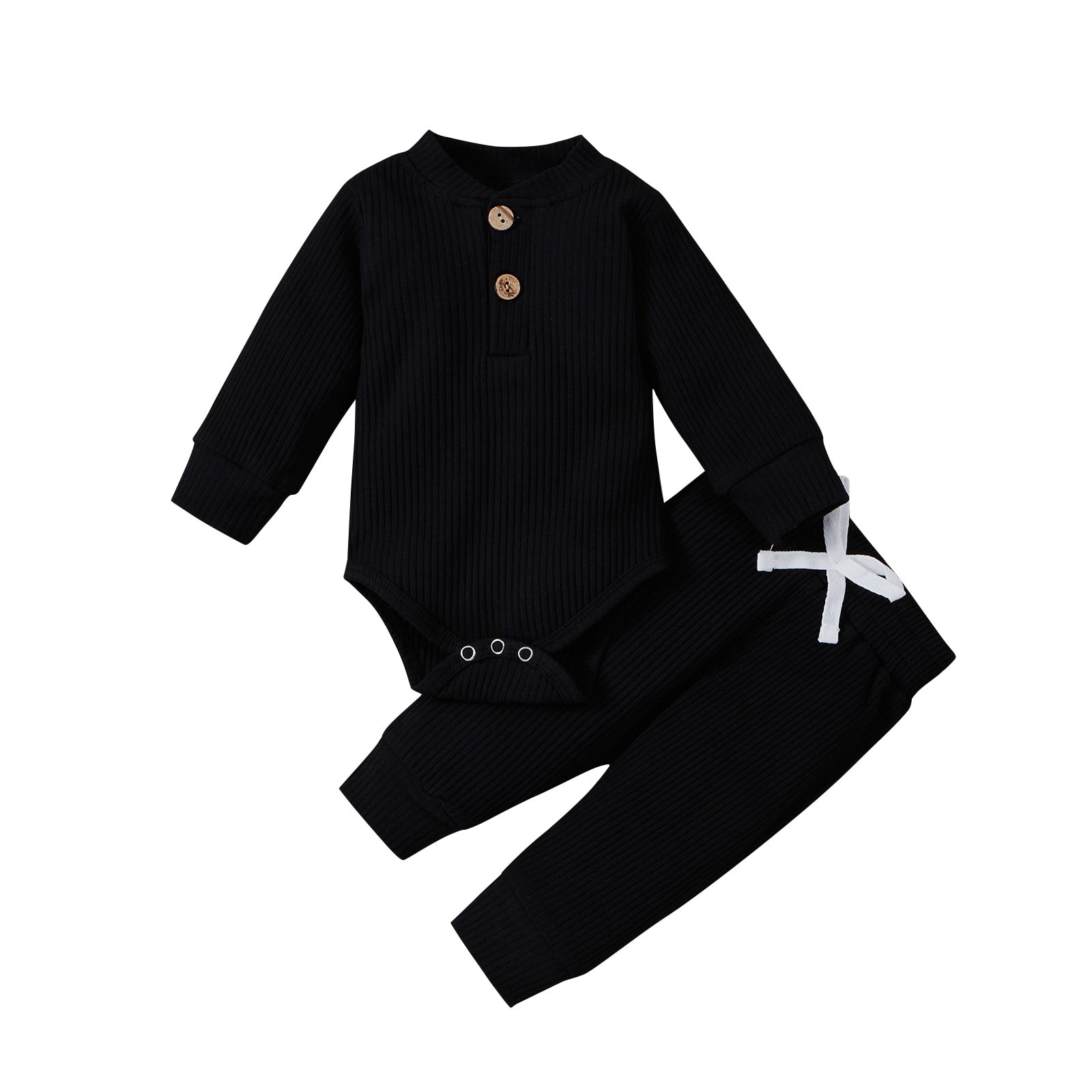 Detail of snaps on the bottom of a ribbed cotton long sleeve romper for easy changes