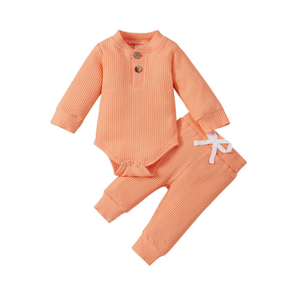 Solid colored ribbed cotton long sleeve romper and pants set for baby