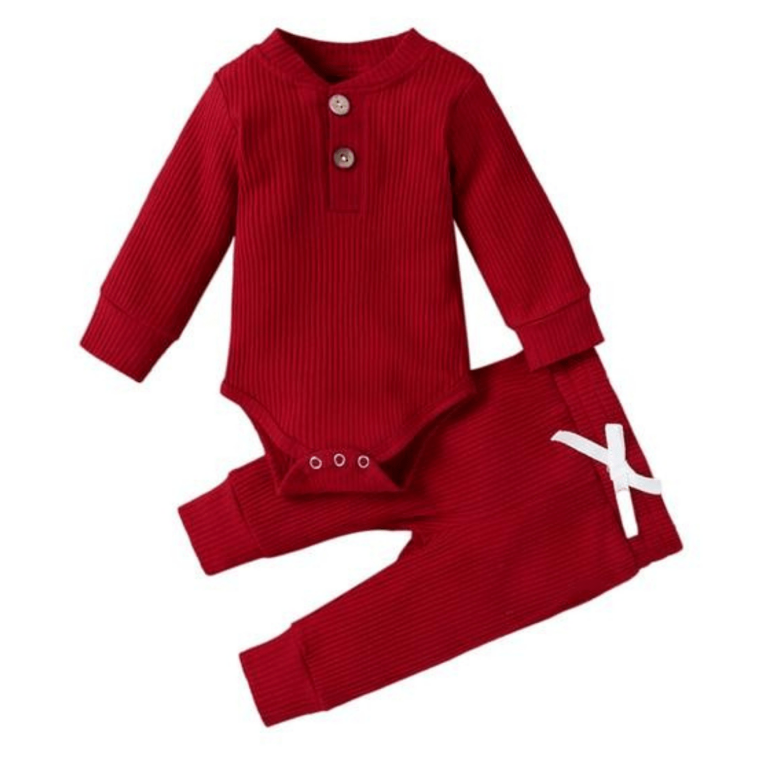 Baby long sleeve romper with crew neck and ribbed texture, part of a cotton set