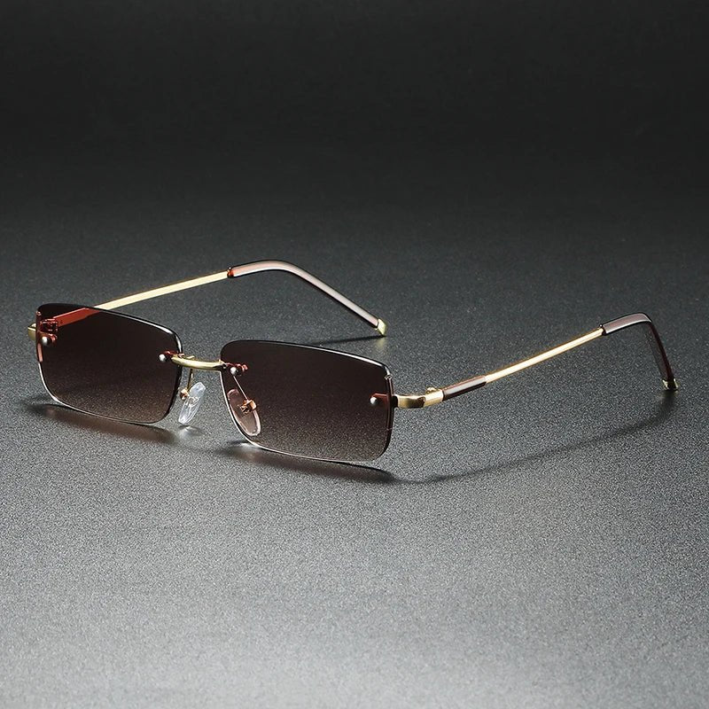 Lightweight unisex rimless sunglasses with gold gradient tint & rectangular frames, providing essential UV protection.