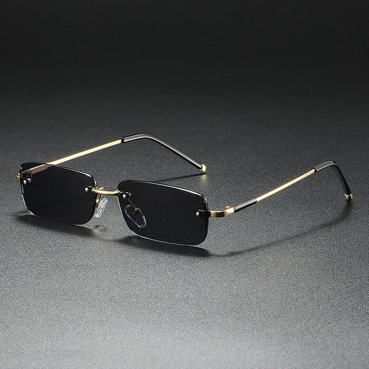 Stylish unisex rimless rectangular sunglasses featuring luxurious gold gradient lenses, offering UV protection & chic modern style.