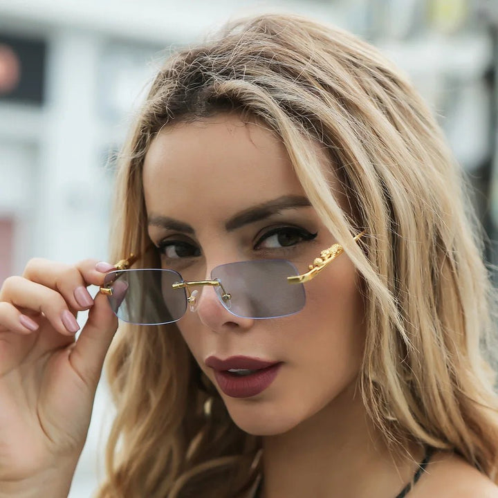 Fashion-forward rimless sunglasses, leopard head temples, perfect for travel. UV400.