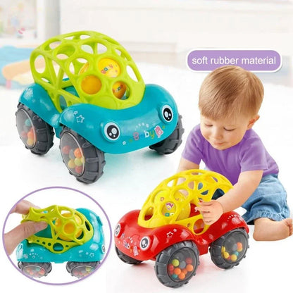 Bright yellow rattle toy car for infants, designed for sensory play and developing toddler motor skills.