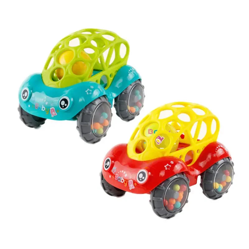 Baby's hand reaching for a rolling rattle toy car, an engaging tool for motor skills and infant play.