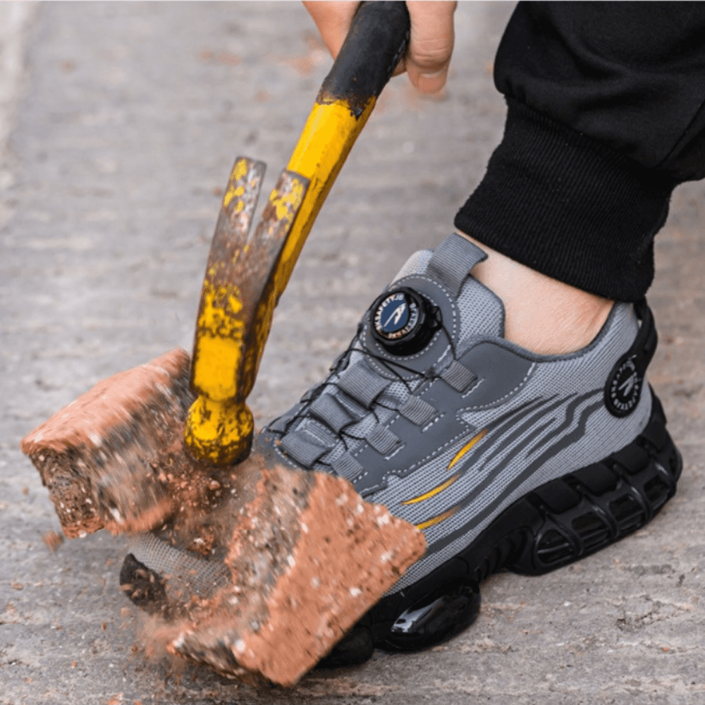 Close-up of a sturdy black safety work shoe, highlighting the wide toe box and durable protective materials.