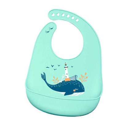 Baby wearing a yellow silicone bib with a large food catcher, illustrating its practical use during feeding