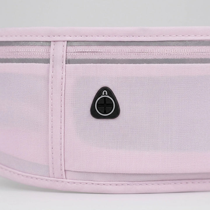 Compact running belt with multiple pockets for keys, cards & gels. Essential workout gear waist pack.