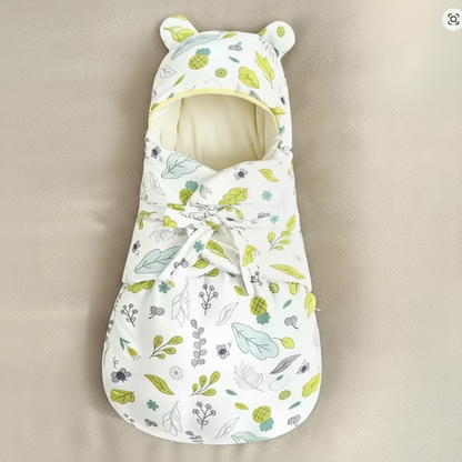 Stack of folded SnuggleBear cotton swaddle blankets, essential baby accessories for sleep and comfort