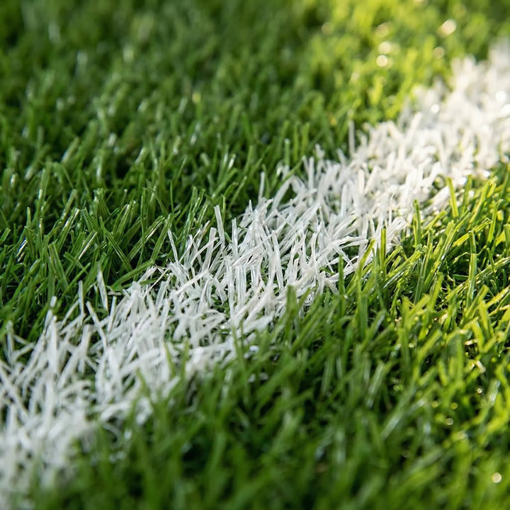 Green soccer field area rug, a washable & non-slip sports decor statement piece for a game room or play space.