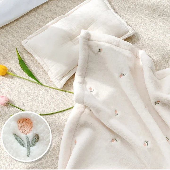 White soft fleece baby blanket, versatile & gentle, keeps newborns & toddlers warm.