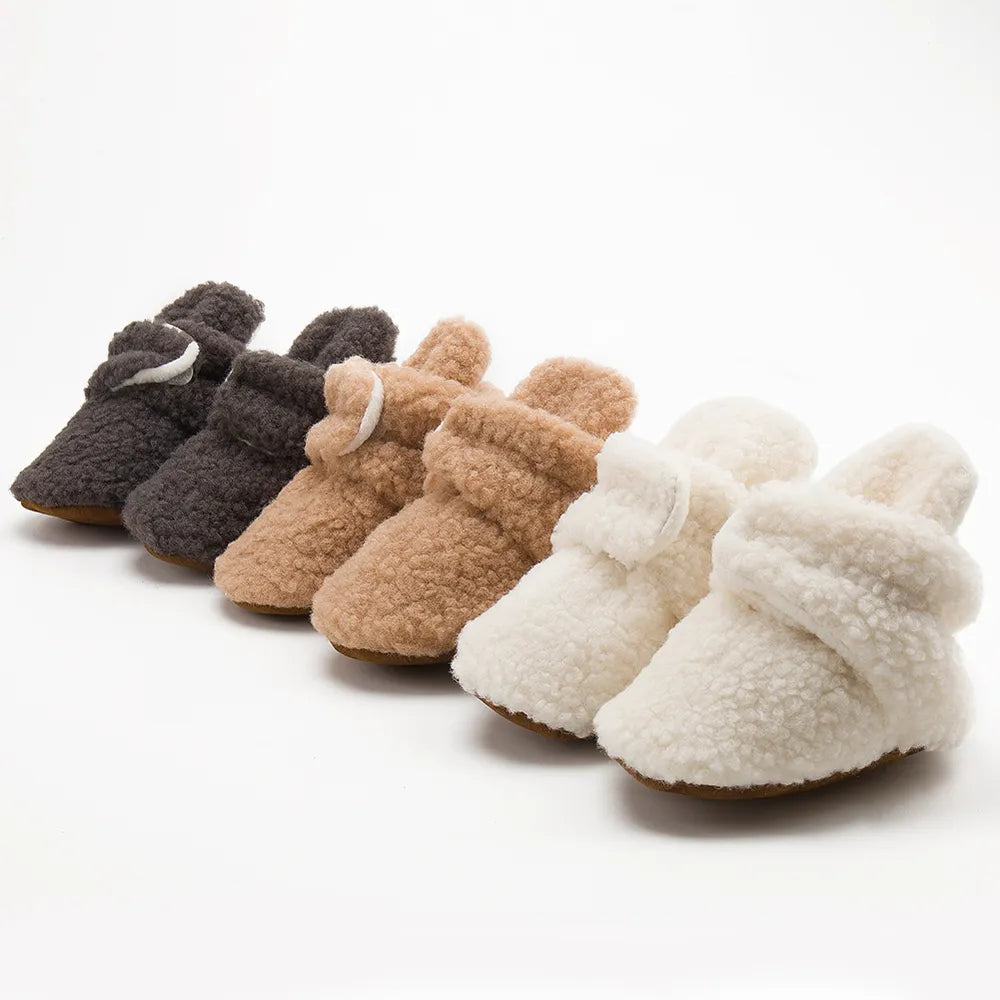 Unisex Soft Fluff Baby Booties, cozy first walkers for infants, white cotton with anti-slip soles.