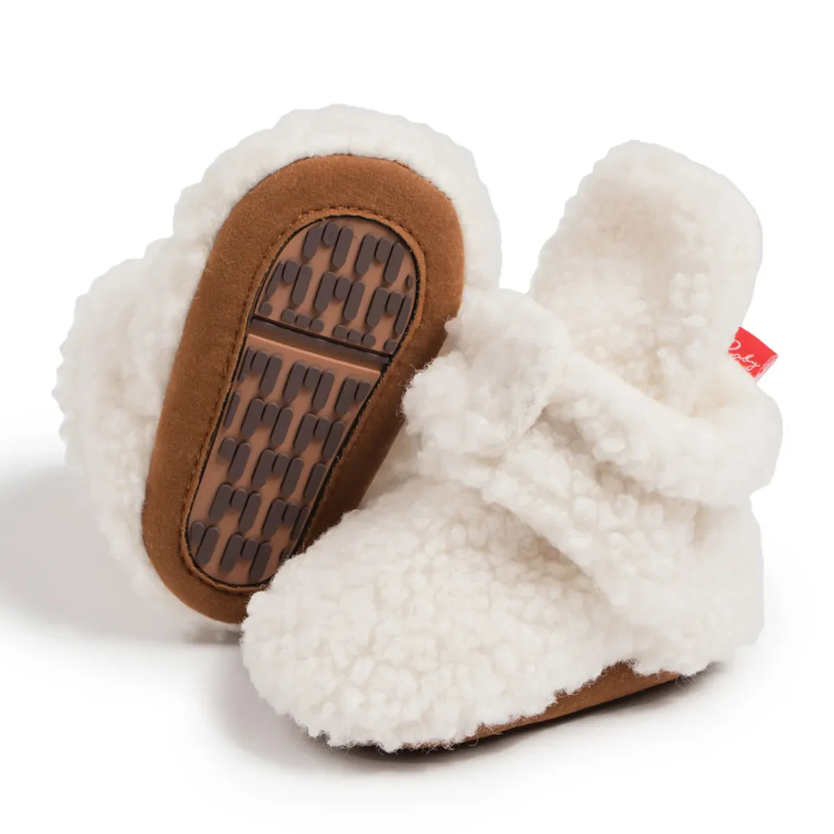Baby's feet in soft fluff booties, unisex design, cozy first walkers, pure cotton, anti-slip.
