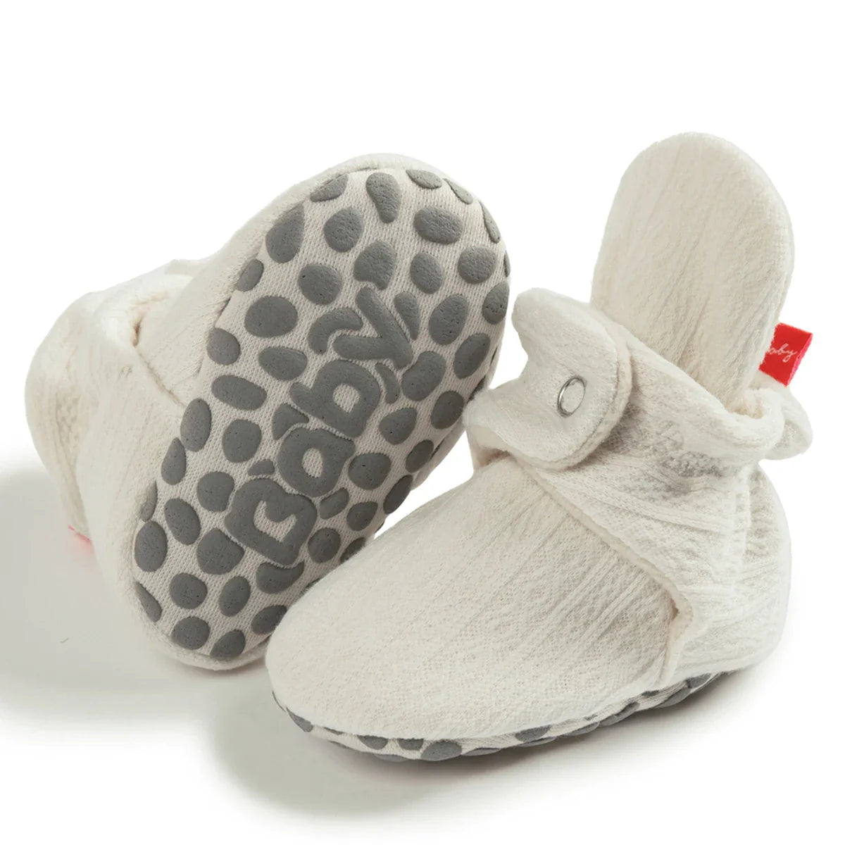 Array of colorful unisex soft fluff baby booties, cozy first walkers, infant footwear, cotton.