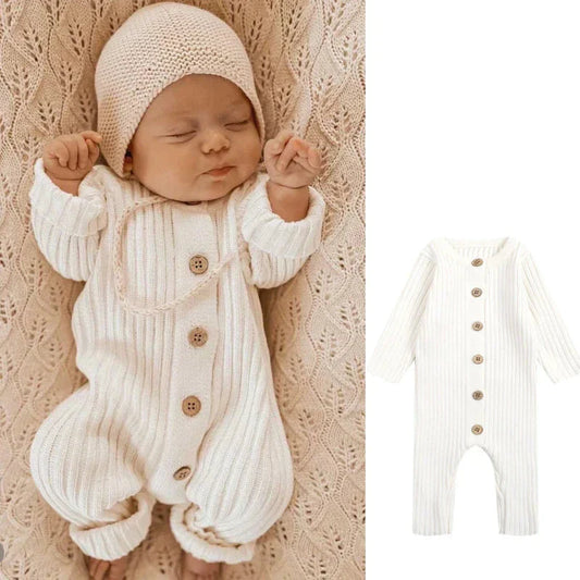 Unisex soft knitted organic cotton baby romper in light grey with long sleeves and snap closures
