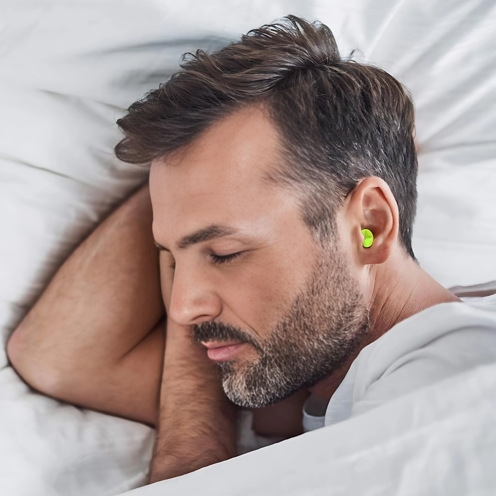 Soft silicone noise canceling earplugs, portable and travel-friendly for quiet sleep and enhanced focus.