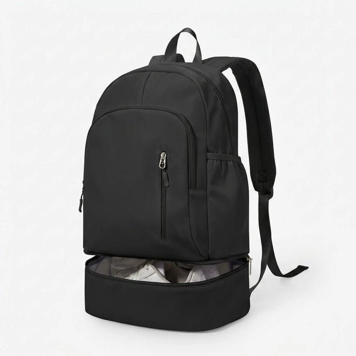 Durable black nylon sports backpack, unisex, with practical shoe compartment & ample organized storage for activewear.
