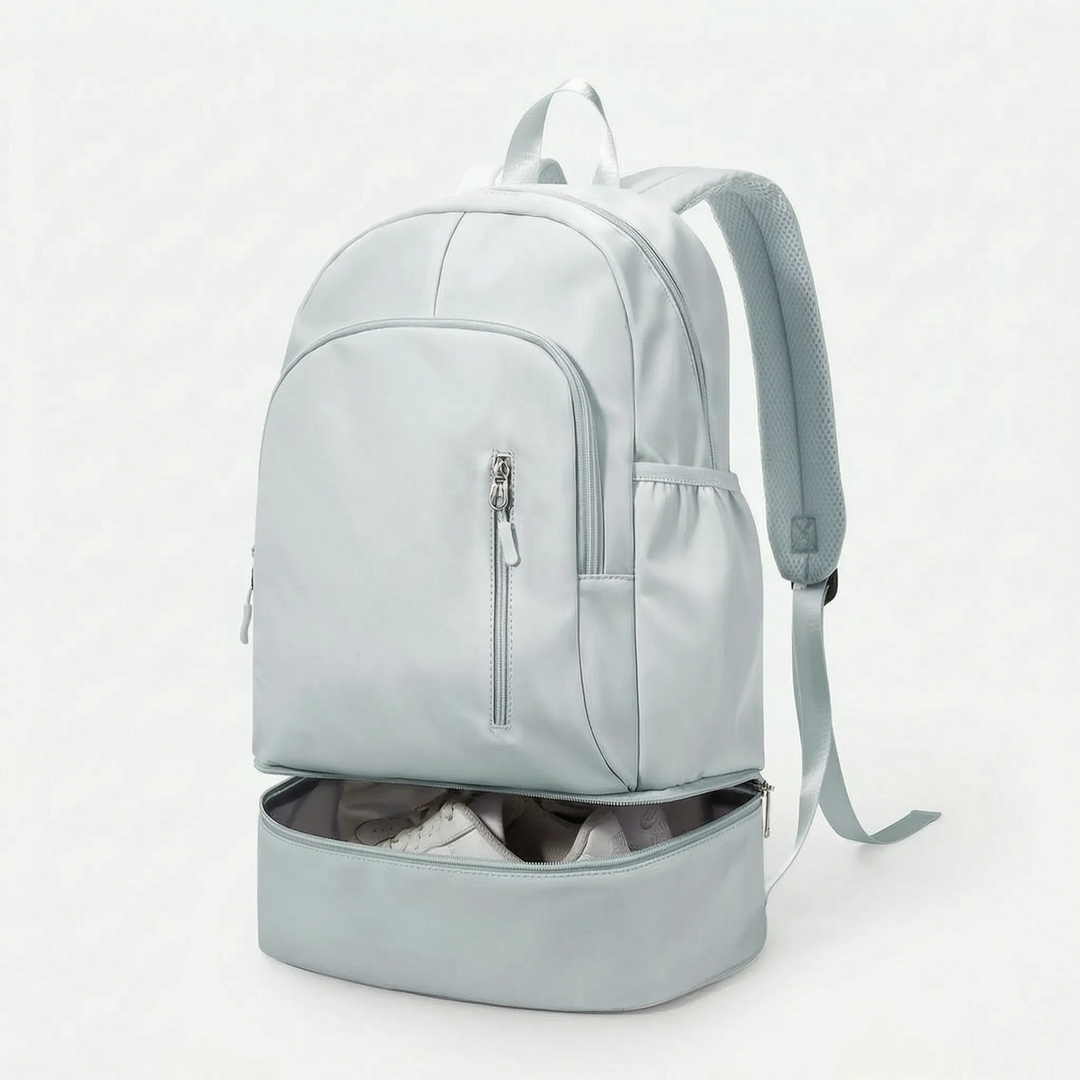 Organized unisex sports backpack with shoe compartment, perfect as a gym bag or travel backpack. Durable nylon for activewear.