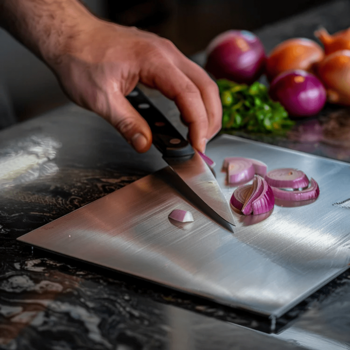Hygienic stainless steel cutting board, perfect for safe kitchen food prep. Rustproof & dishwasher safe.