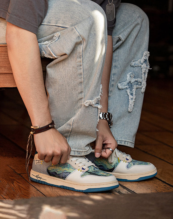 Close-up: Starry Night sneakers. Detailed Van Gogh inspired pattern on comfortable, artistic unisex shoes.