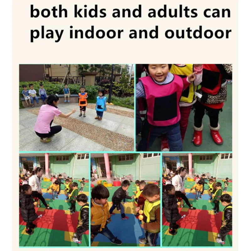 Two children laughing, wearing sticky vests, playing throw and catch outdoor game set