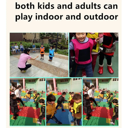 Two children laughing, wearing sticky vests, playing throw and catch outdoor game set