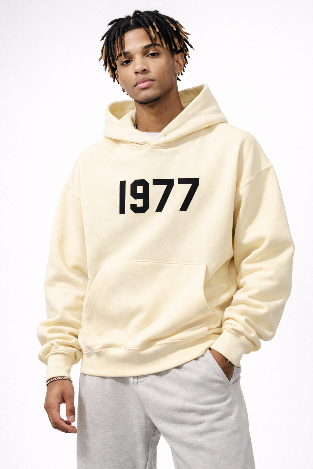Detail of the unique raglan sleeves & 1977 print on a fashionable unisex streetwear hoodie.