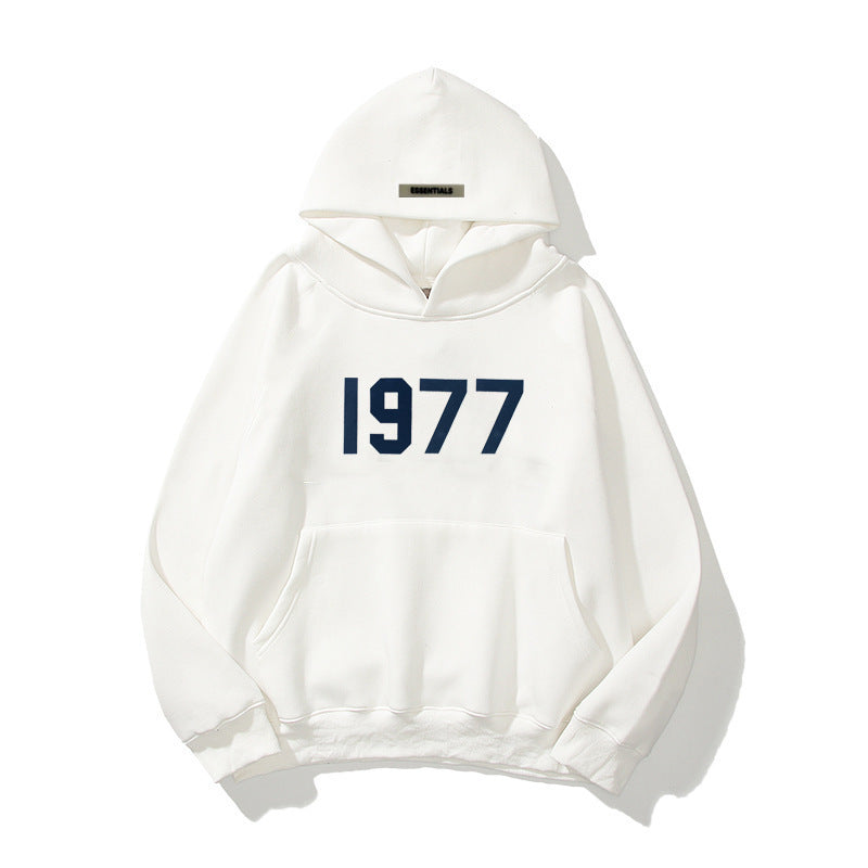Close-up of the 1977 print on a comfortable unisex raglan sleeve streetwear pullover hoodie.