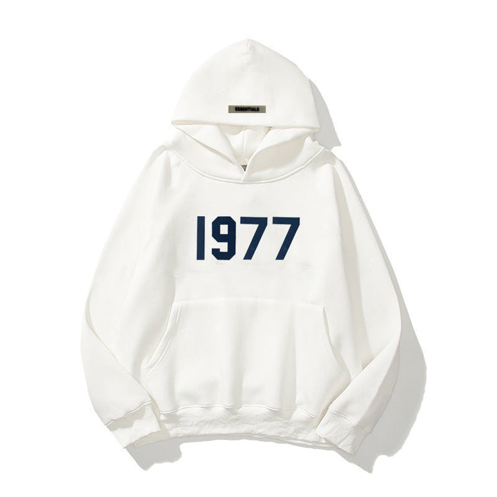 Close-up of the 1977 print on a comfortable unisex raglan sleeve streetwear pullover hoodie.