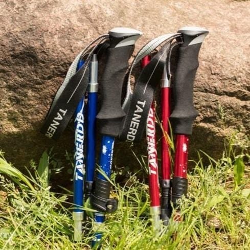 Black lightweight telescopic trekking poles. Durable and adjustable for all outdoor adventures & trail essentials.